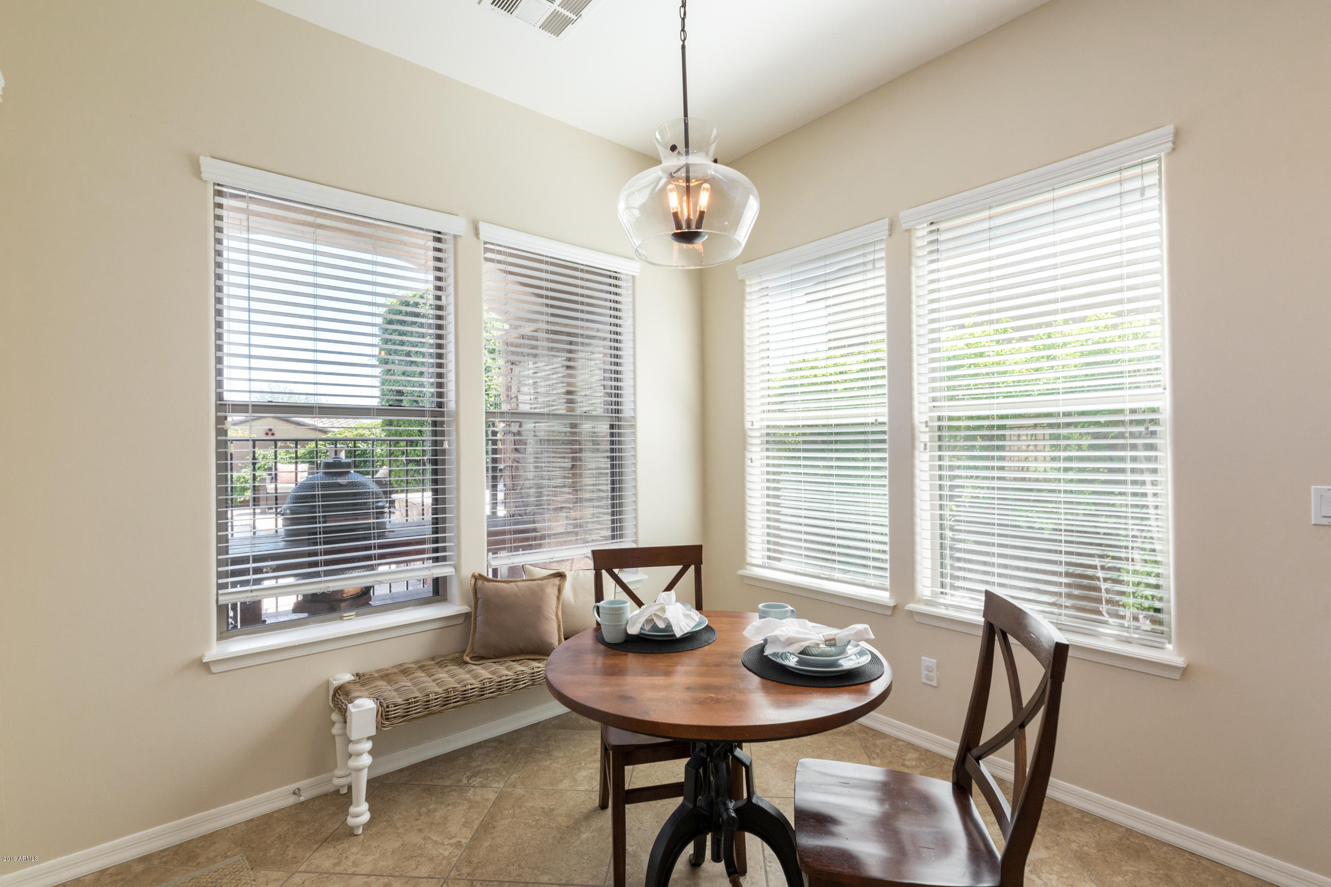 9185 East Canyon View Road Scottsdale, AZ 85255 - Photo 12 of 47 a dining room with furniture and window