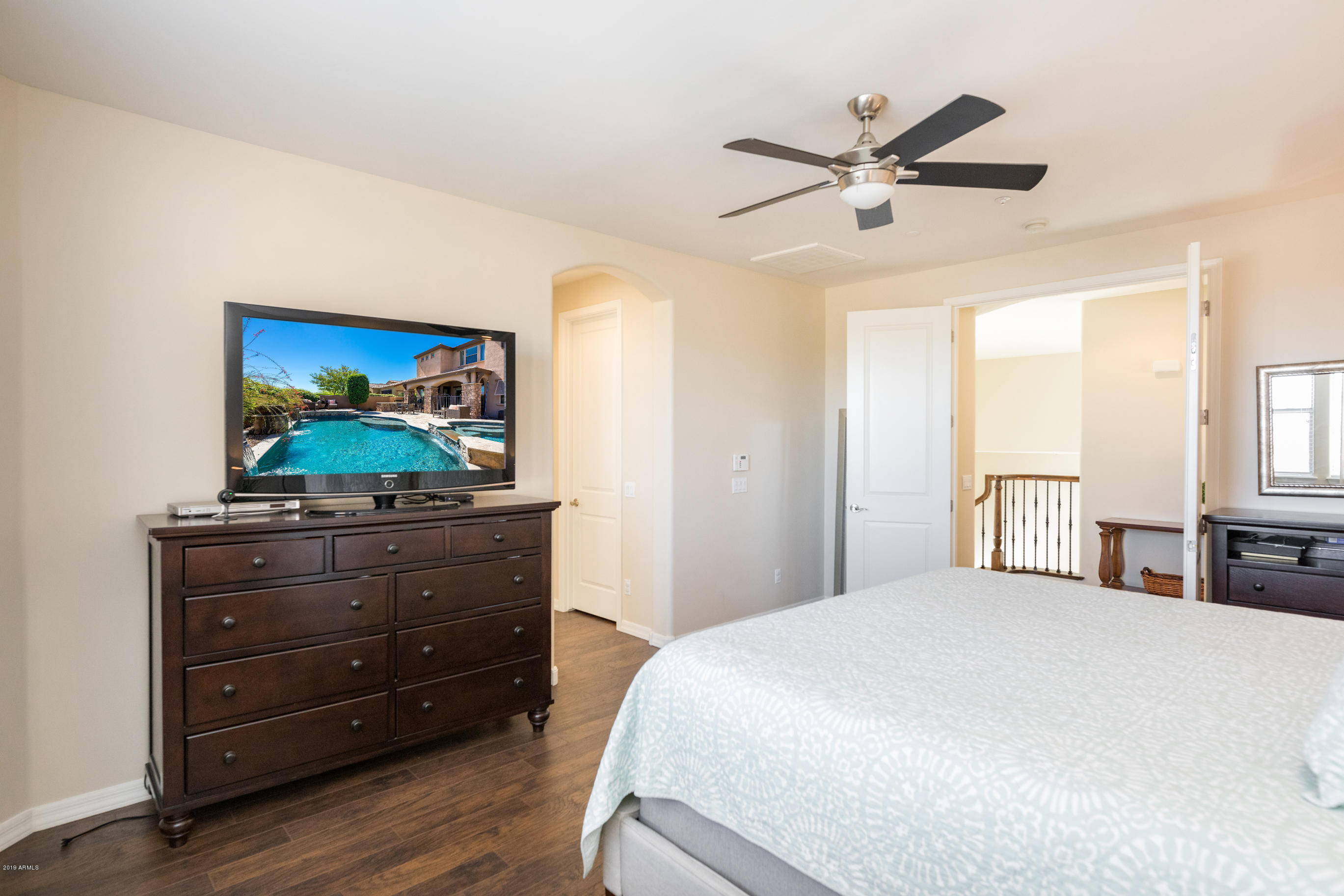 9185 East Canyon View Road Scottsdale, AZ 85255 - Photo 22 of 47 a bedroom with a bed and a dresser
