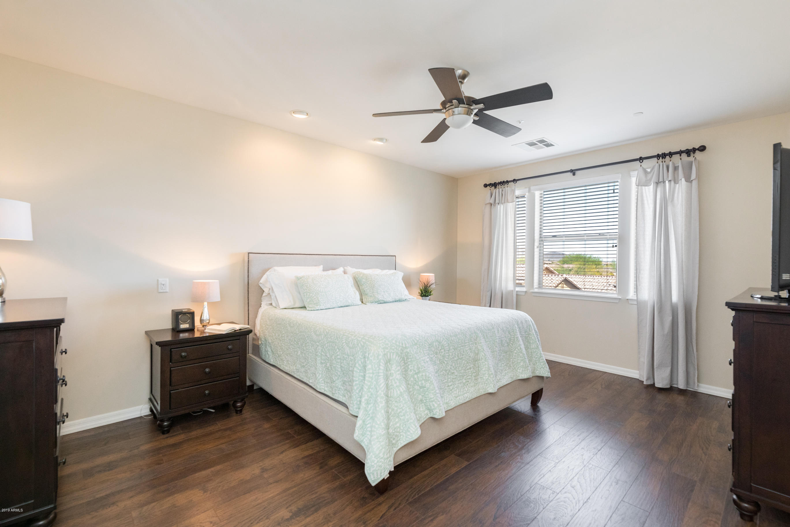 9185 East Canyon View Road Scottsdale, AZ 85255 - Photo 23 of 47 a bedroom with a bed and a window