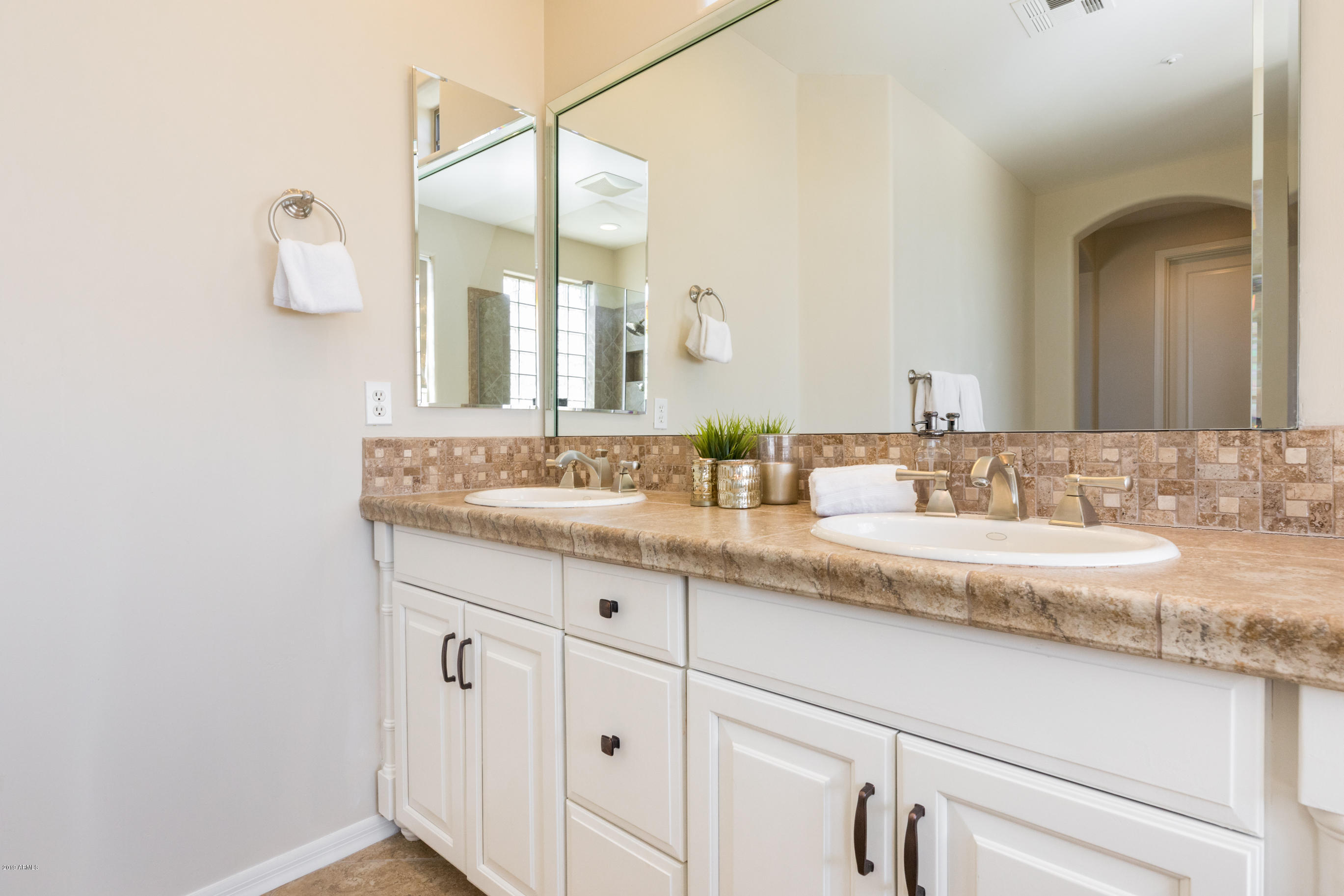 9185 East Canyon View Road Scottsdale, AZ 85255 - Photo 27 of 47 a bathroom with a granite countertop sink and a mirror
