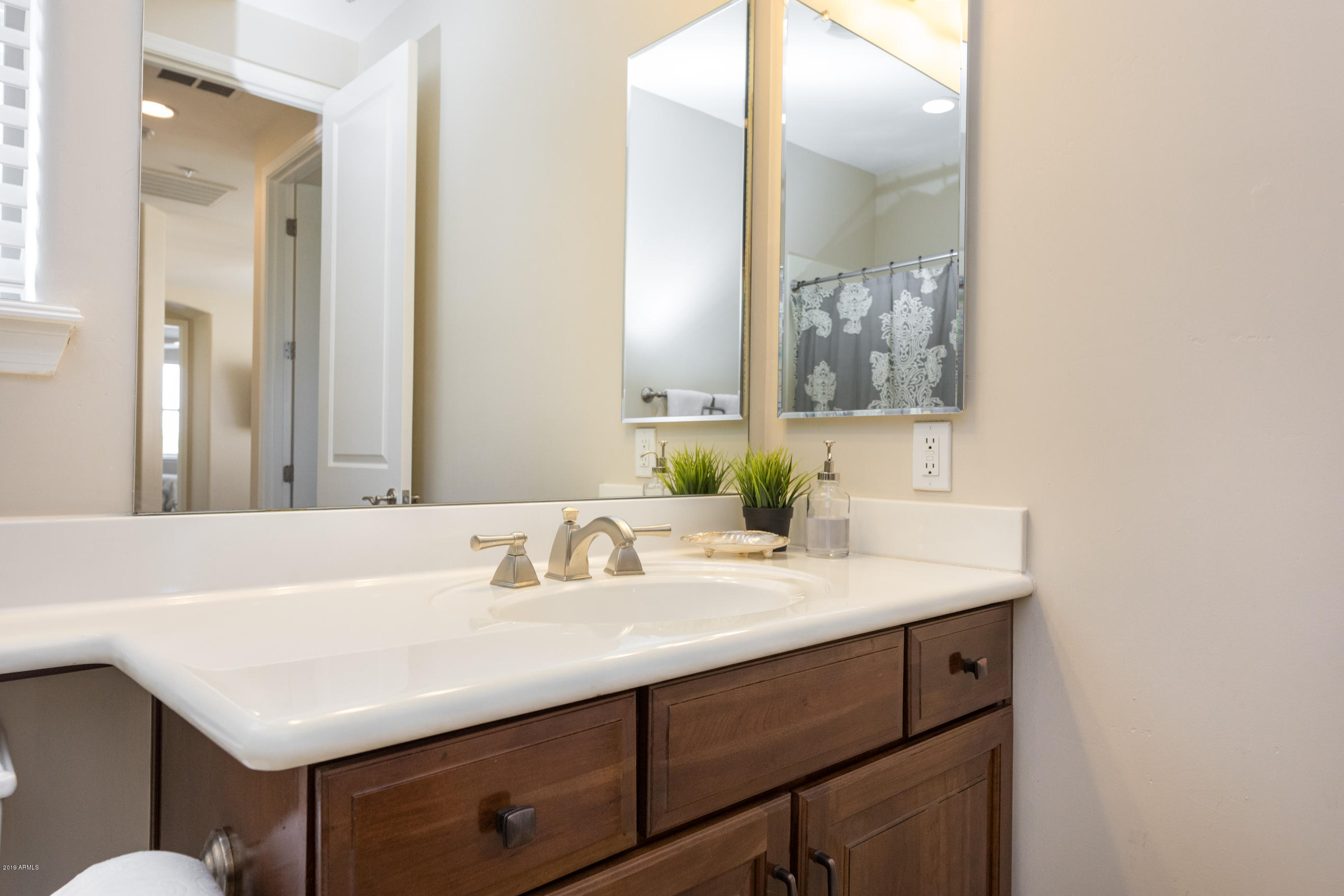 9185 East Canyon View Road Scottsdale, AZ 85255 - Photo 33 of 47 a bathroom with a sink and a mirror