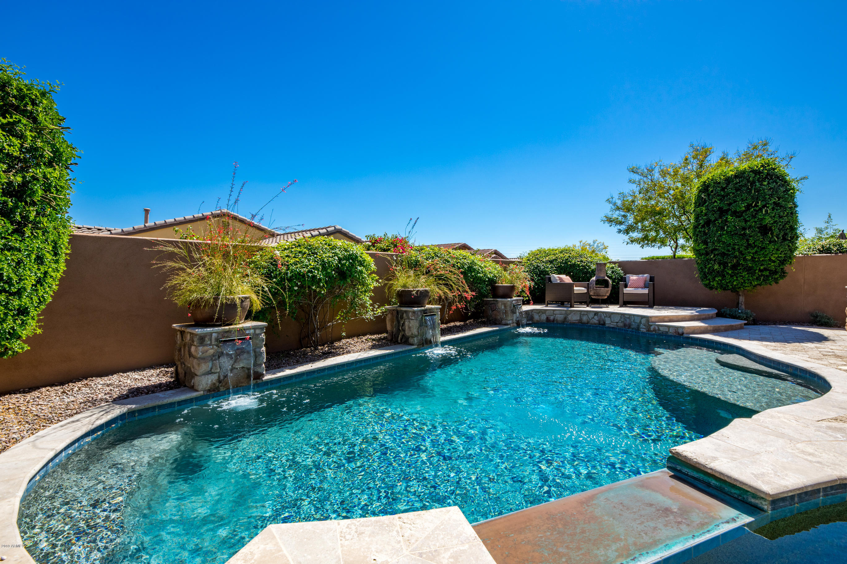 9185 East Canyon View Road Scottsdale, AZ 85255 - Photo 39 of 47 a view of a backyard with sitting area