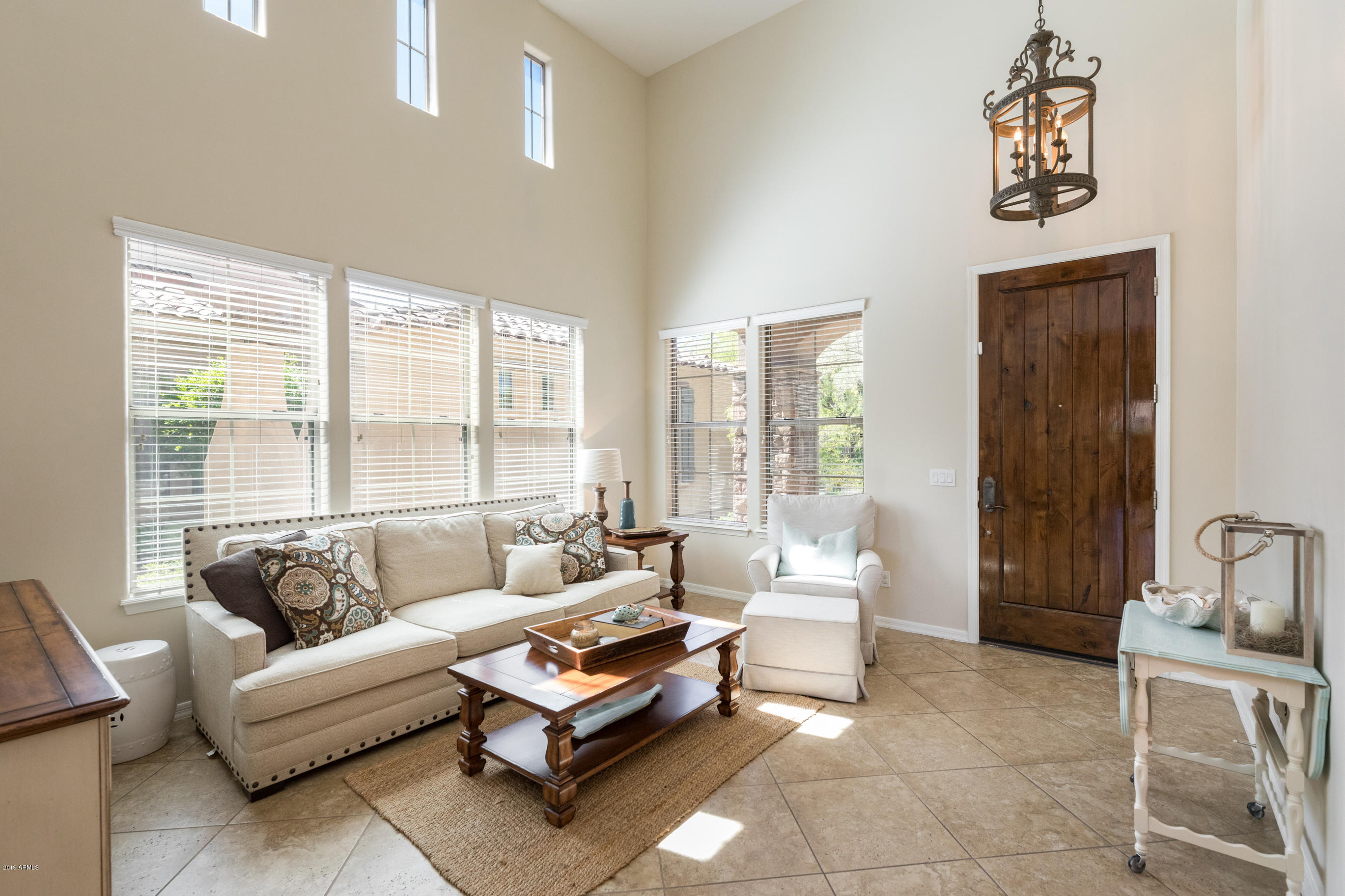 9185 East Canyon View Road Scottsdale, AZ 85255 - Photo 6 of 47 a living room with furniture and a large window