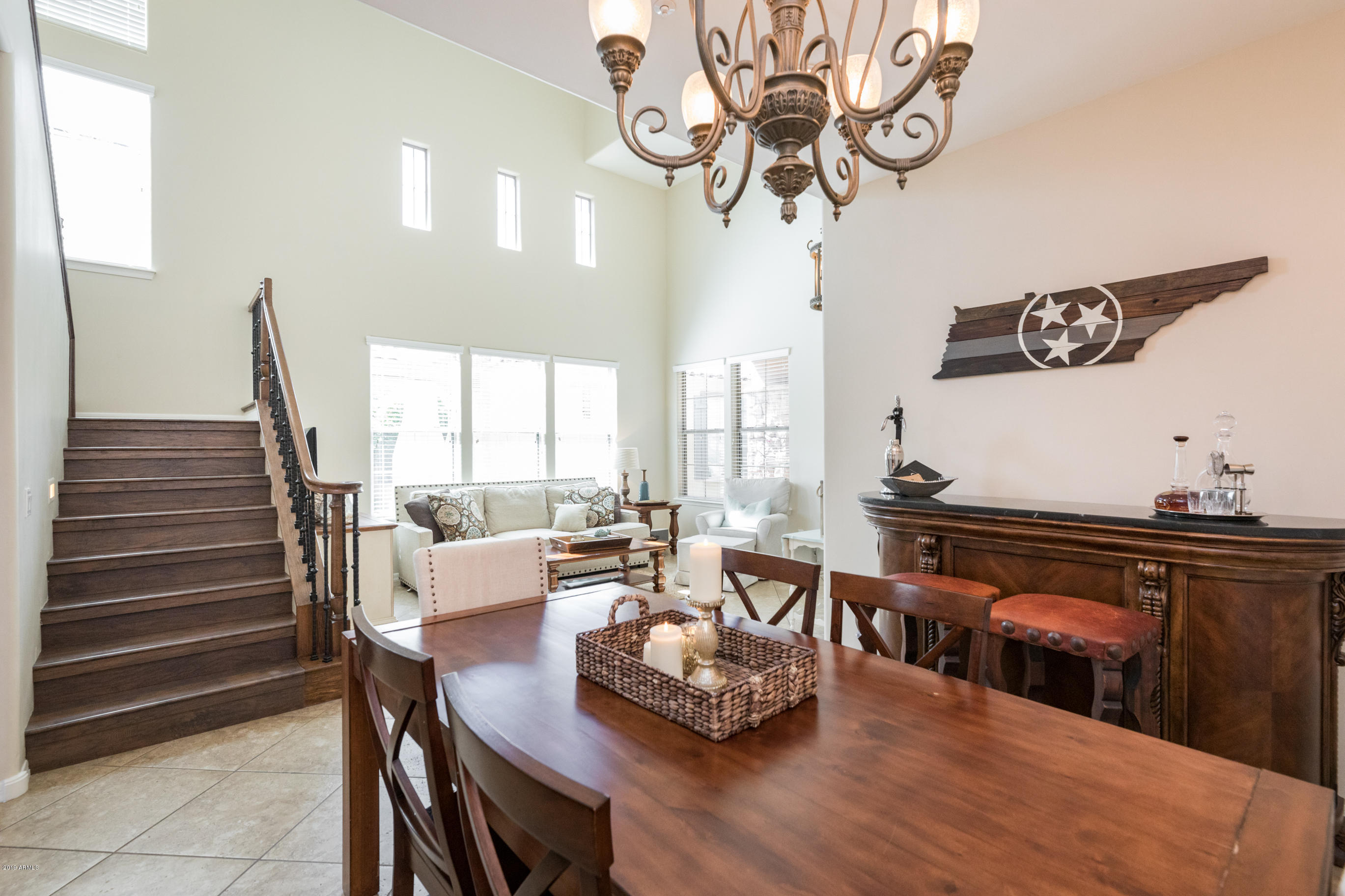 9185 East Canyon View Road Scottsdale, AZ 85255 - Photo 9 of 47 a living room with furniture and wooden floor