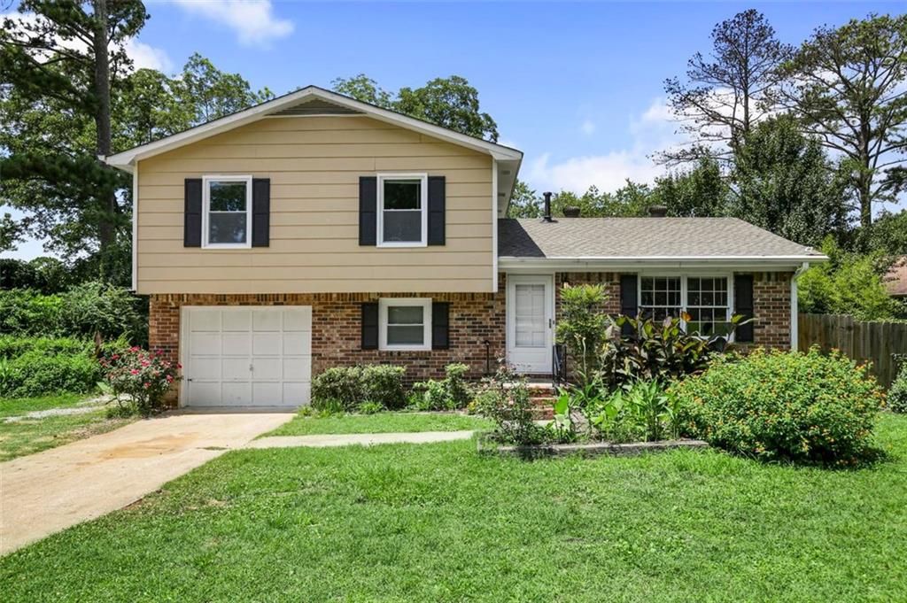 a front view of a house with a yard and porch