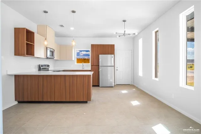 a view of kitchen and windows