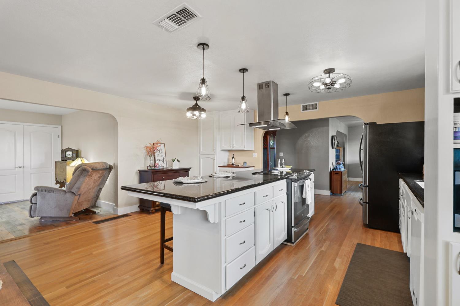 10691 Calvine Road Sacramento, CA 95830 - Photo 15 of 47 a kitchen with stainless steel appliances granite countertop a sink stove and refrigerator