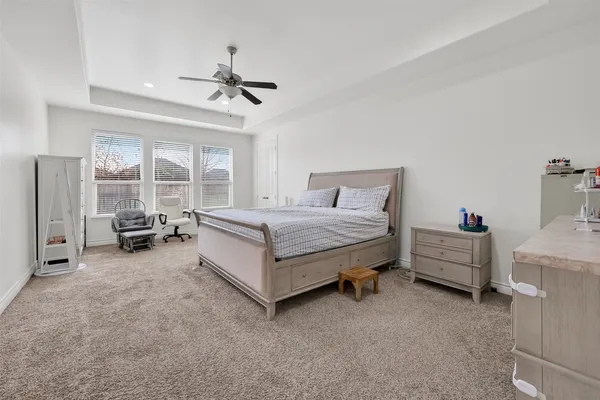 a bedroom with furniture and window