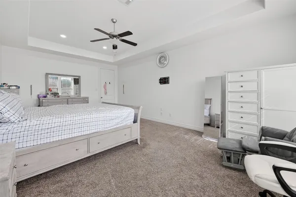 a bedroom with a bed and furniture