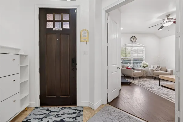a living room with furniture and a rug