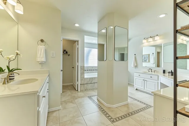 a spacious bathroom with a mirror sink and shower