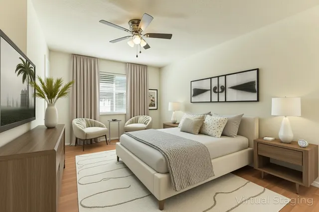 an empty room with a chandelier fan and windows