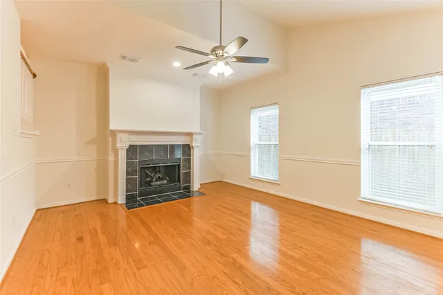 a kitchen with appliances cabinets and chair