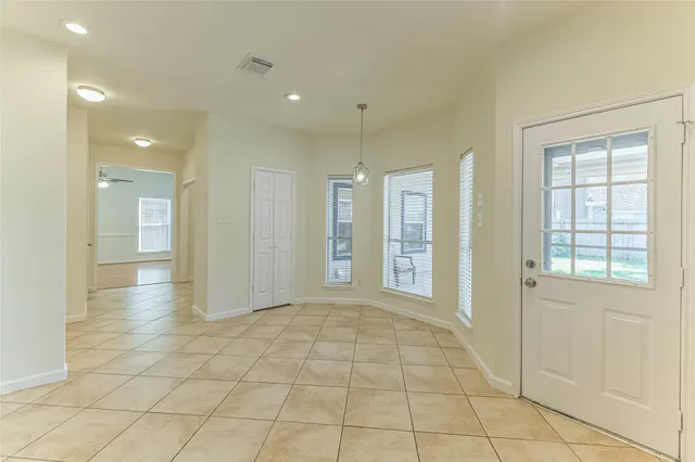 a view of a dining room with furniture window and outside view