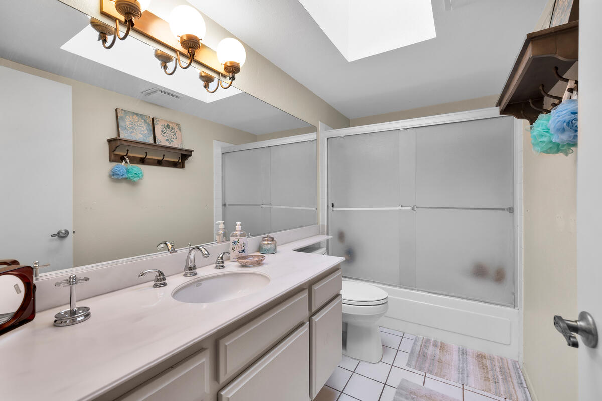 44149 Chamonix Court Palm Desert, CA 92260 - Photo 16 of 50 a bathroom with a sink a toilet and shower