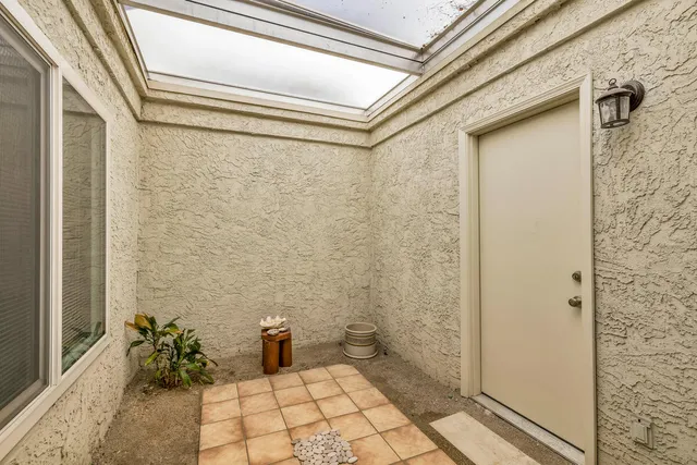 a bedroom with a bed and dresser