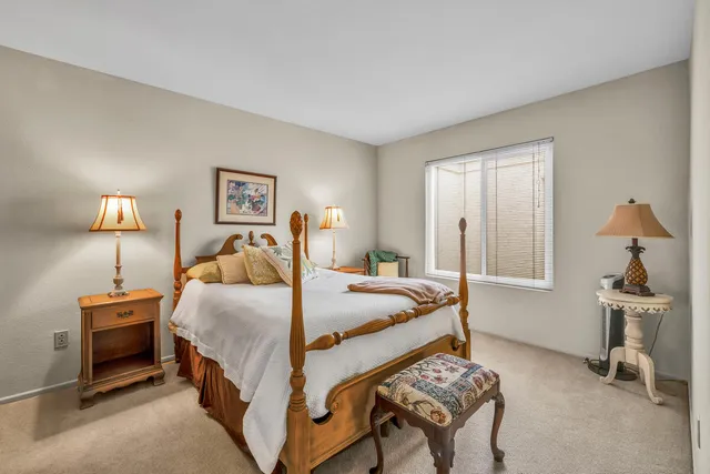 a bedroom with a bed and a dresser