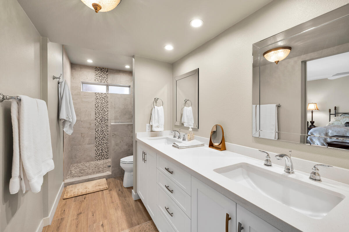 44149 Chamonix Court Palm Desert, CA 92260 - Photo 25 of 50 a bathroom with a double vanity sink mirror double and shower