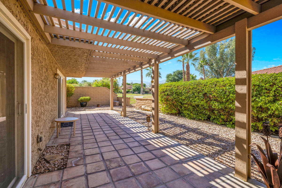 44149 Chamonix Court Palm Desert, CA 92260 - Photo 27 of 50 a porch with view of a patio