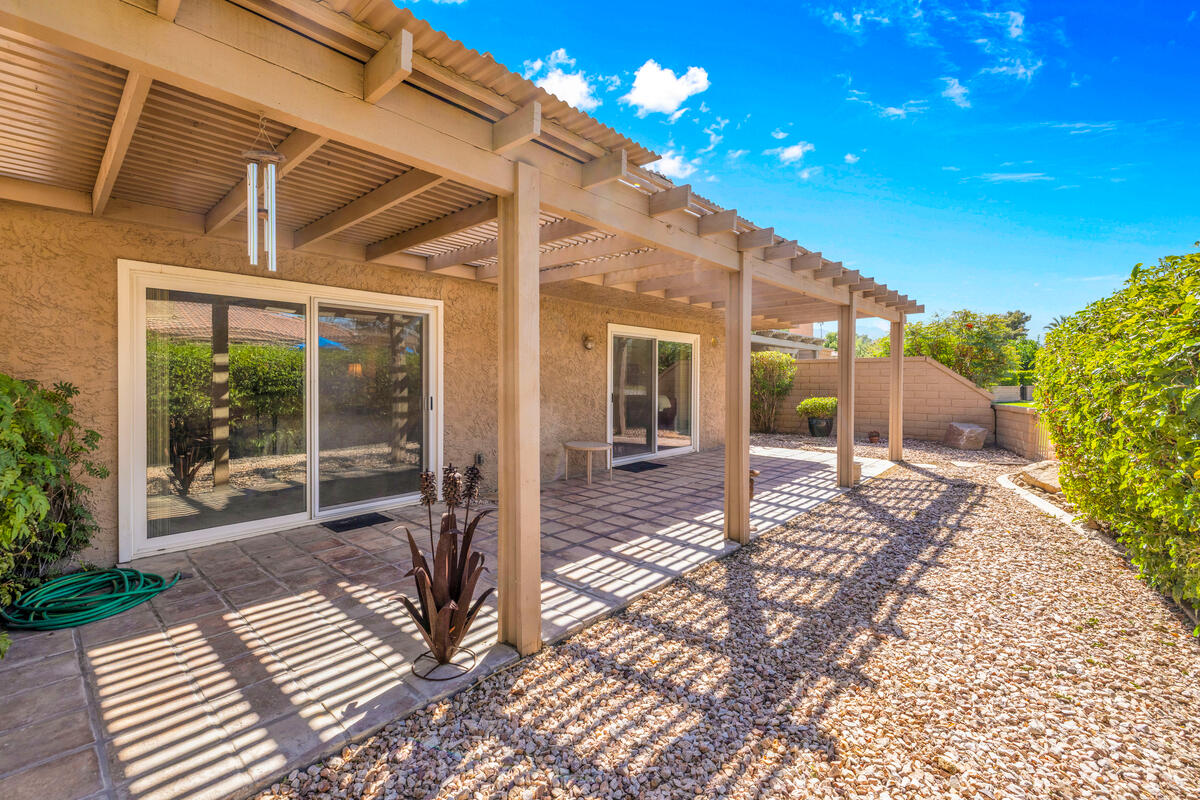 44149 Chamonix Court Palm Desert, CA 92260 - Photo 28 of 50 a view of a house with backyard and porch