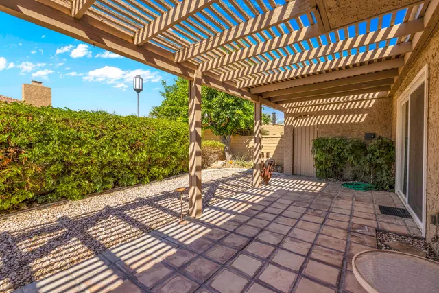 an aerial view of a house with a swimming pool