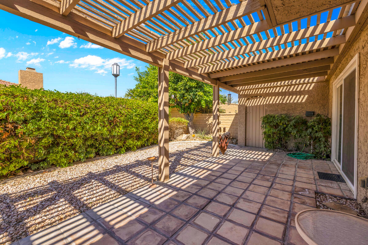 44149 Chamonix Court Palm Desert, CA 92260 - Photo 30 of 50 a view of a porch with wooden floor