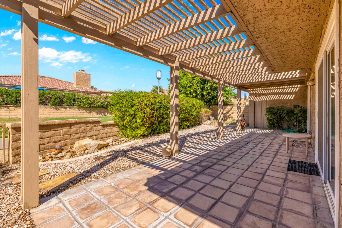 44149 Chamonix Court Palm Desert, CA 92260 - Photo 31 of 50 a view of a patio with wooden floor