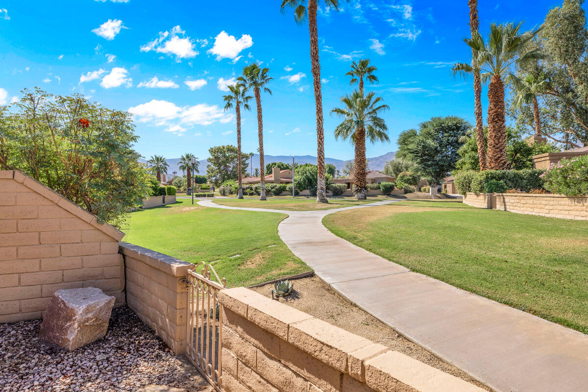 44149 Chamonix Court Palm Desert, CA 92260 - Photo 32 of 50 a view of a backyard and swimming pool