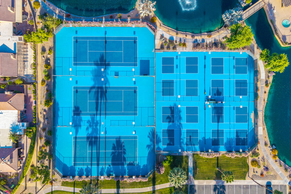 44149 Chamonix Court Palm Desert, CA 92260 - Photo 46 of 50 a front view of a building with a yard