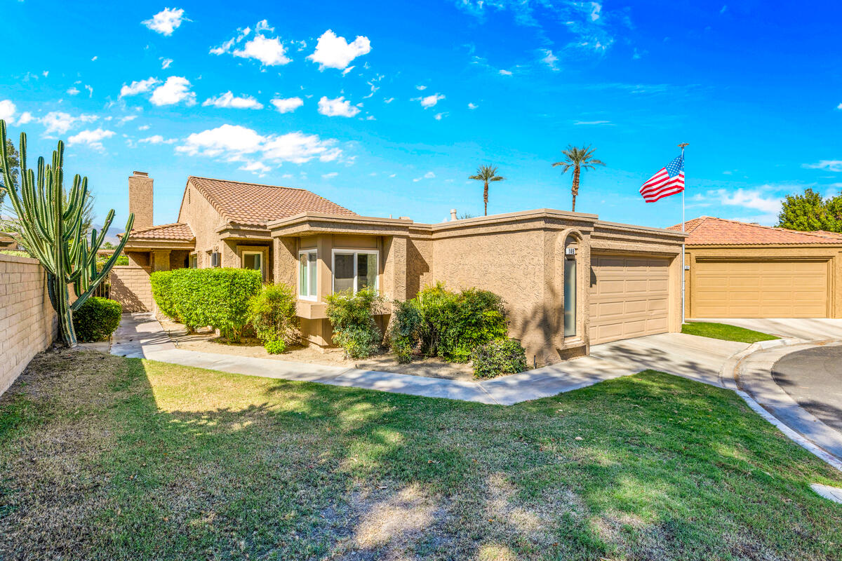 44149 Chamonix Court Palm Desert, CA 92260 - Photo 5 of 50 a front view of a house with a yard