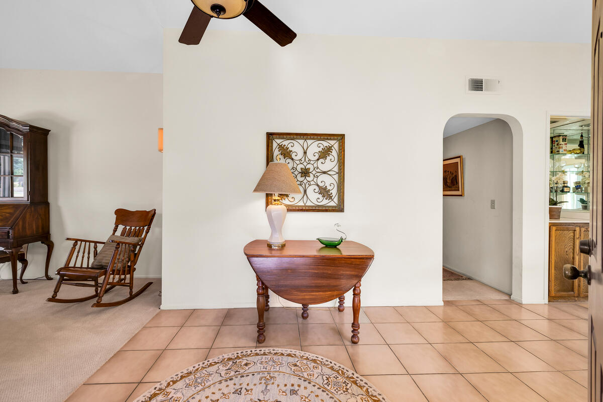 44149 Chamonix Court Palm Desert, CA 92260 - Photo 8 of 50 a living room with furniture and a window