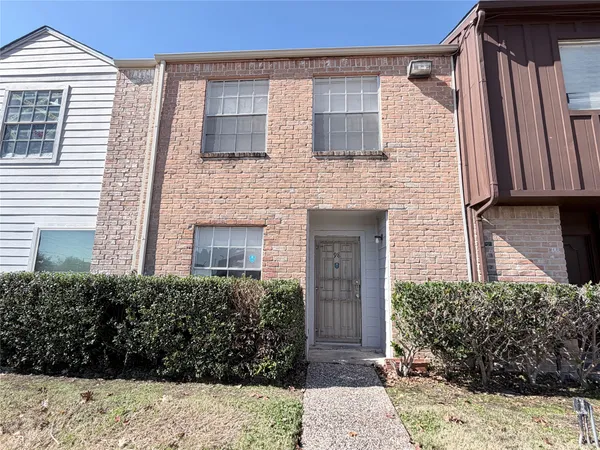 a view of house with yard