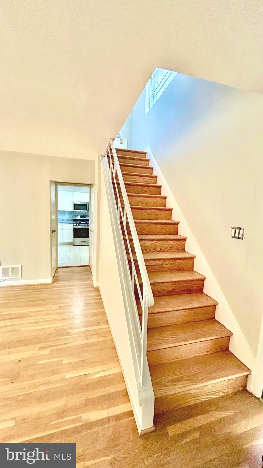 5319 Pooks Hill Road, Unit 1 Bethesda, MD 20814 - Photo 33 of 37 a view of entryway and hall with wooden floor