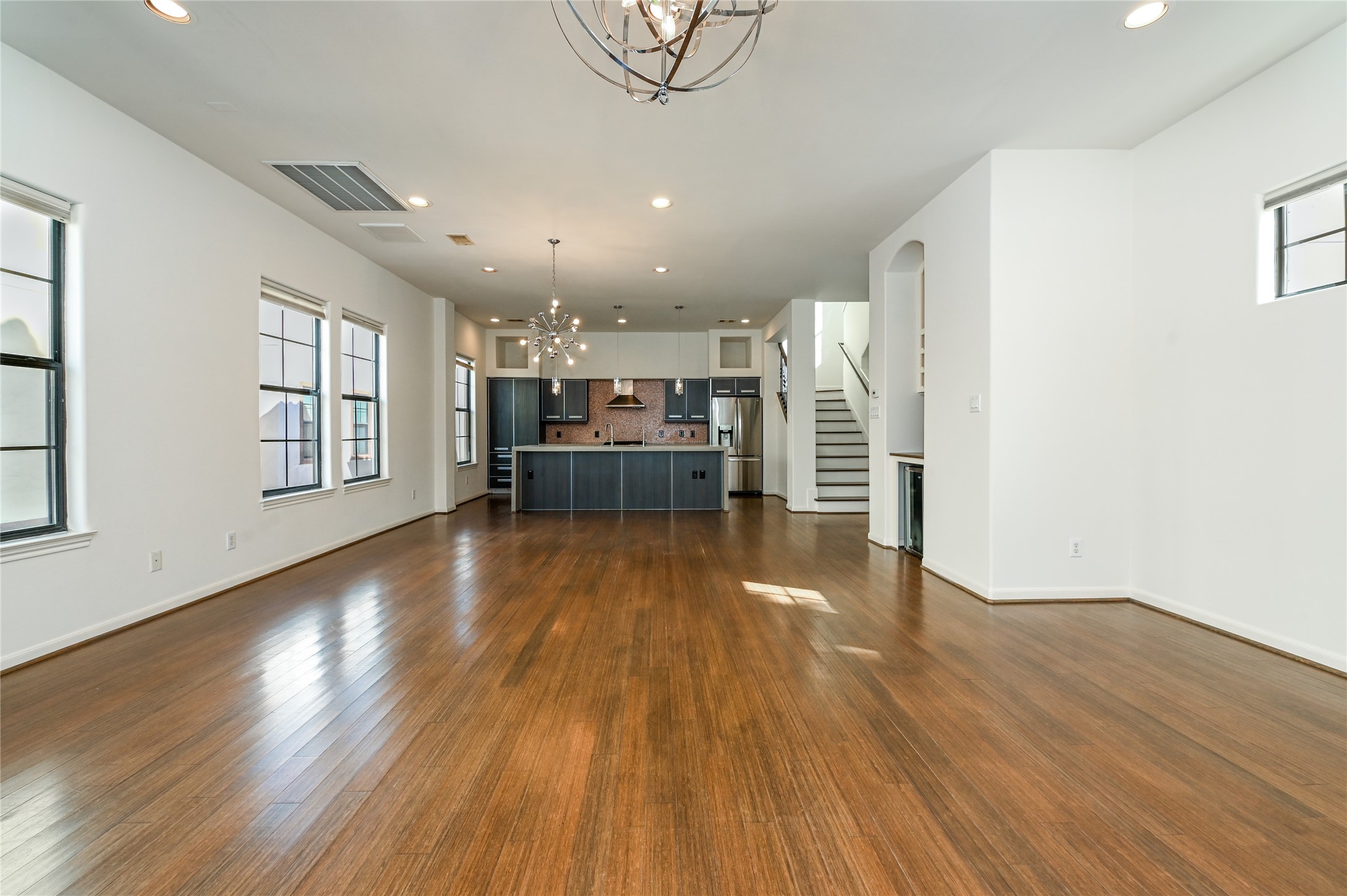 3948 Feagan Street Houston, TX 77007 - Photo 12 of 30 a view of empty room with wooden floor and windows