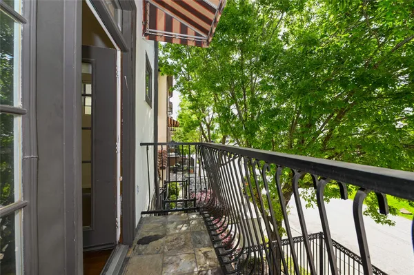 a view of a balcony with an outdoor space