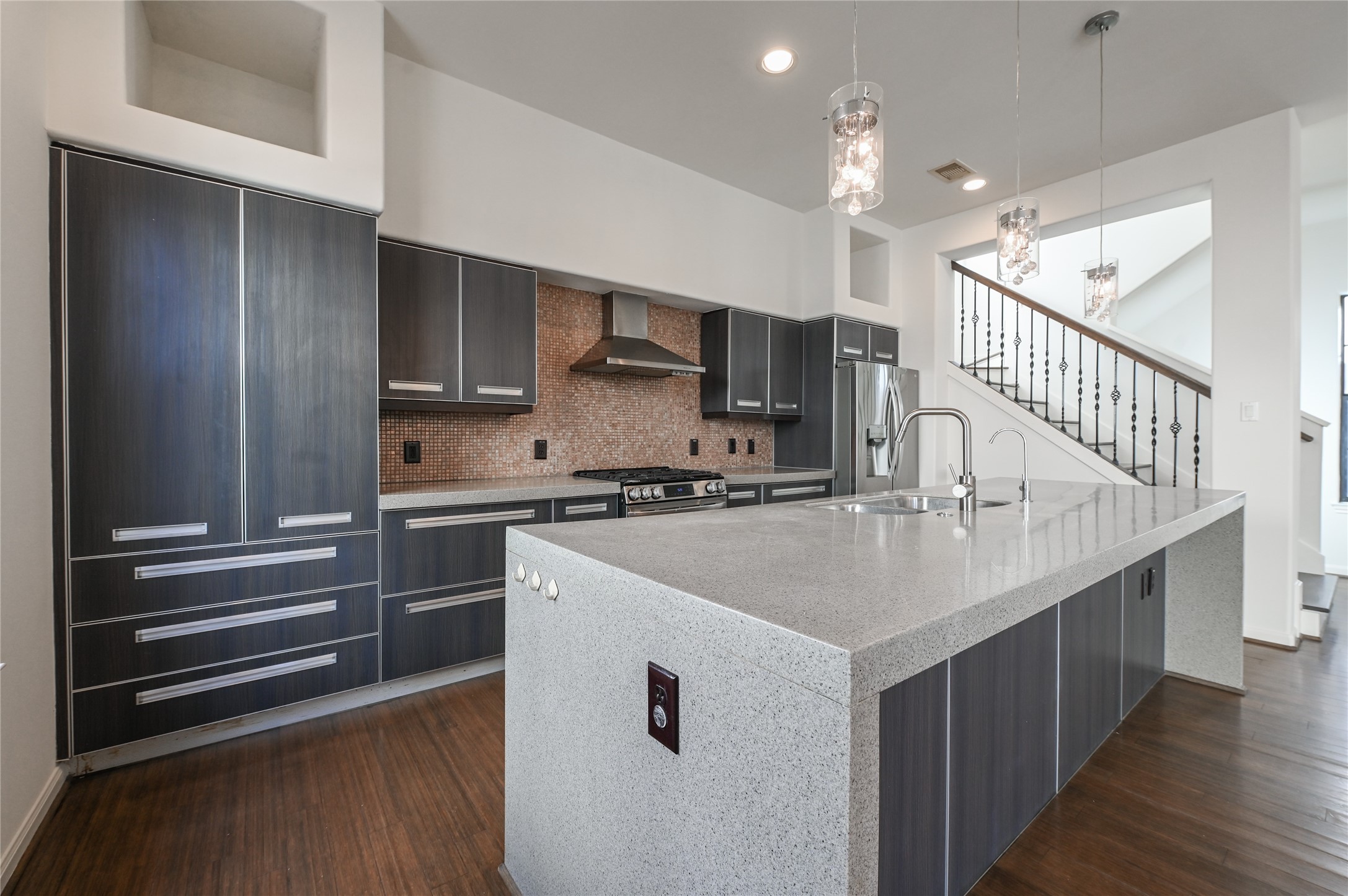 3948 Feagan Street Houston, TX 77007 - Photo 7 of 30 a kitchen with kitchen island a sink appliances and cabinets