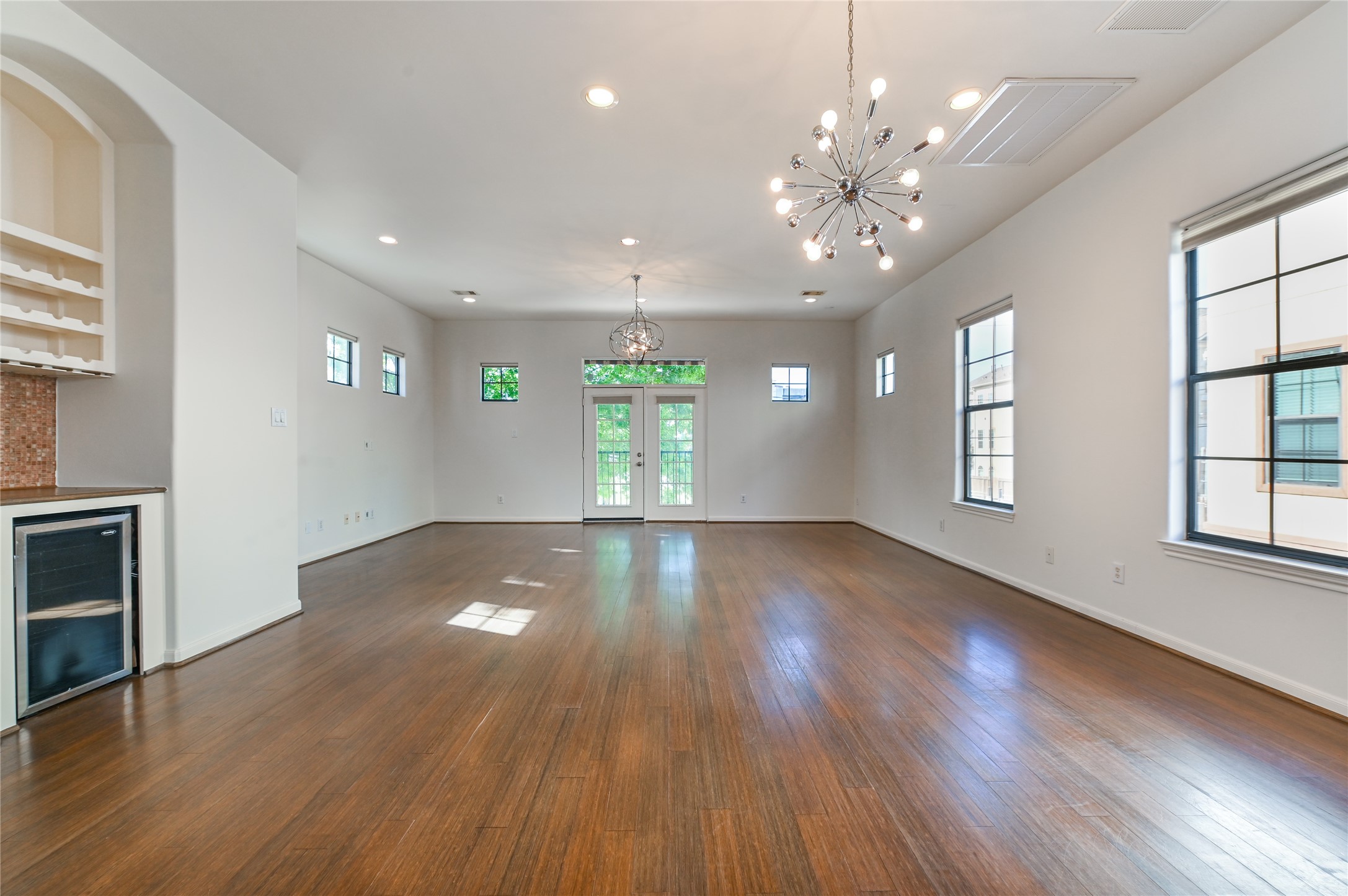 3948 Feagan Street Houston, TX 77007 - Photo 8 of 30 a view of an empty room with wooden floor and a window
