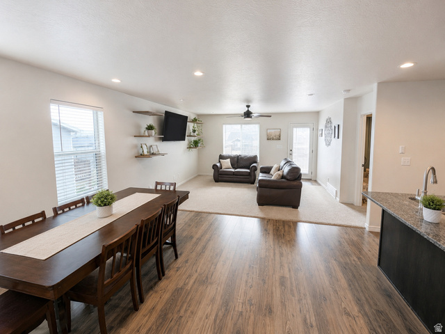 1687 South Windemere Road Santaquin, UT 84655 - Photo 4 of 27 Open-concept living area featuring wood-finish flooring, recessed lighting, and a neutral color palette