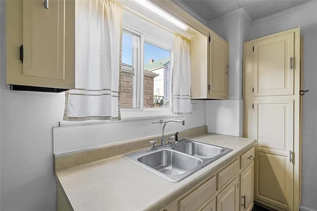 a kitchen with a sink and a refrigerator