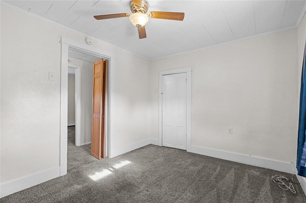 404 1/2 Franklin Avenue Vandergrift, PA 15690 - Photo 20 of 31 an empty room with windows and fan