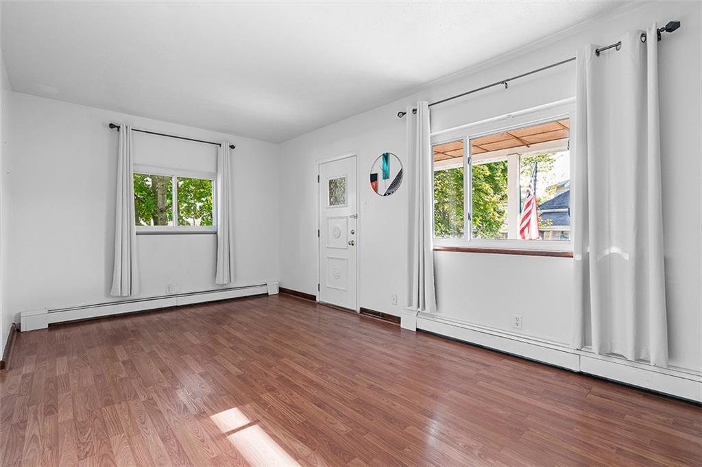 404 1/2 Franklin Avenue Vandergrift, PA 15690 - Photo 2 of 31 an empty room with wooden floor and windows