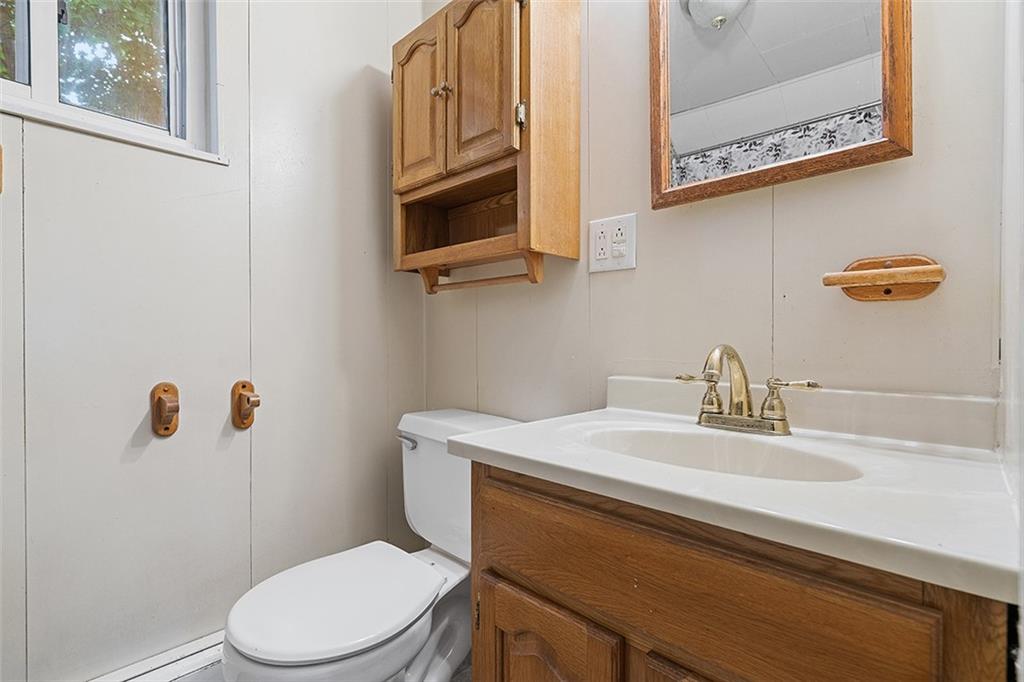 404 1/2 Franklin Avenue Vandergrift, PA 15690 - Photo 21 of 31 a bathroom with a sink a toilet and mirror