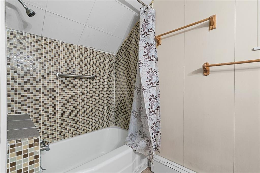 404 1/2 Franklin Avenue Vandergrift, PA 15690 - Photo 22 of 31 a bathroom with a bathtub and shower