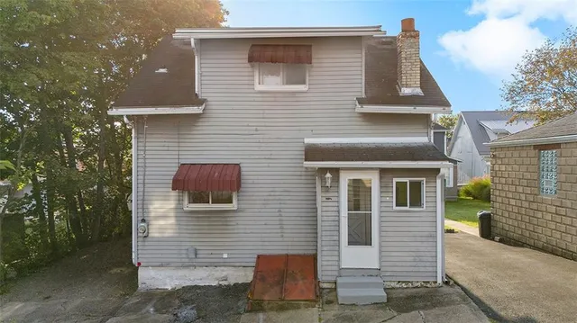 a front view of a house with stairs
