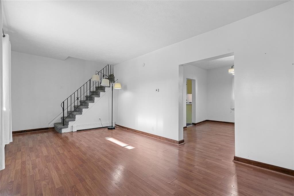 404 1/2 Franklin Avenue Vandergrift, PA 15690 - Photo 5 of 31 a view of an empty room with wooden floor