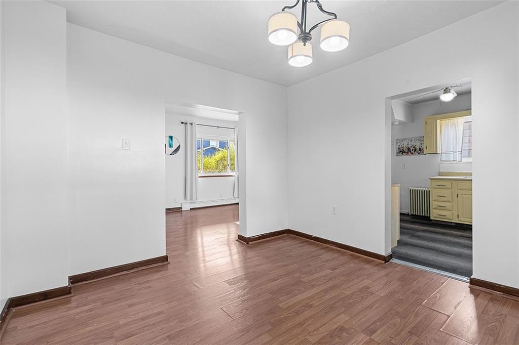404 1/2 Franklin Avenue Vandergrift, PA 15690 - Photo 7 of 31 an empty room with wooden floor and window