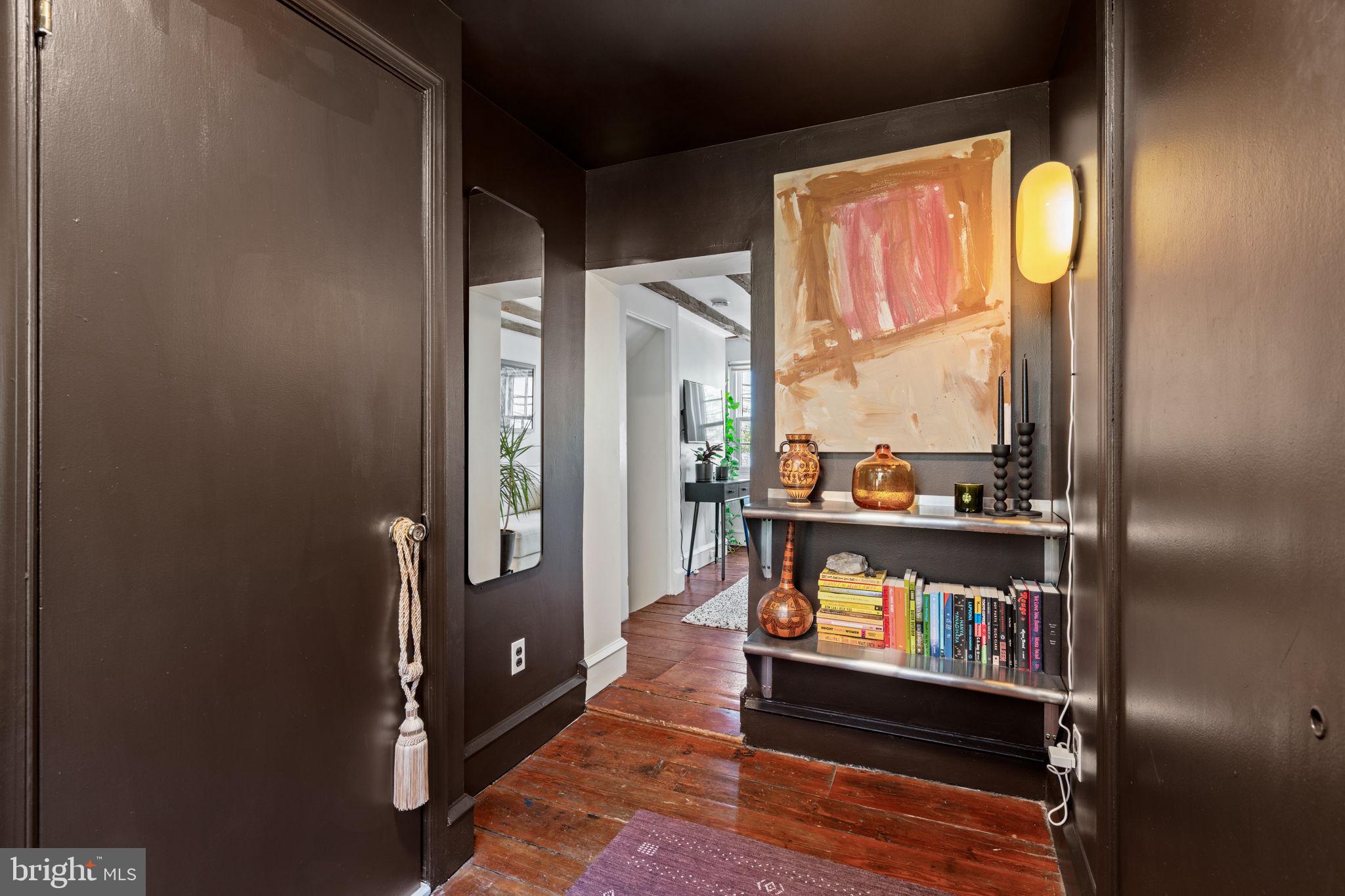 142 Carpenter Street Philadelphia, PA 19147 - Photo 29 of 49 a living room with furniture and a floor to ceiling window
