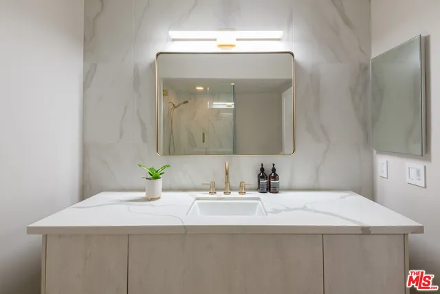 a bathroom with a bathtub and a shower