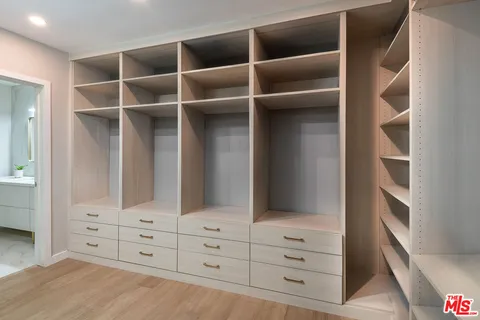 a view of an empty walk in closet