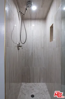 a living room with fireplace furniture and a book shelf